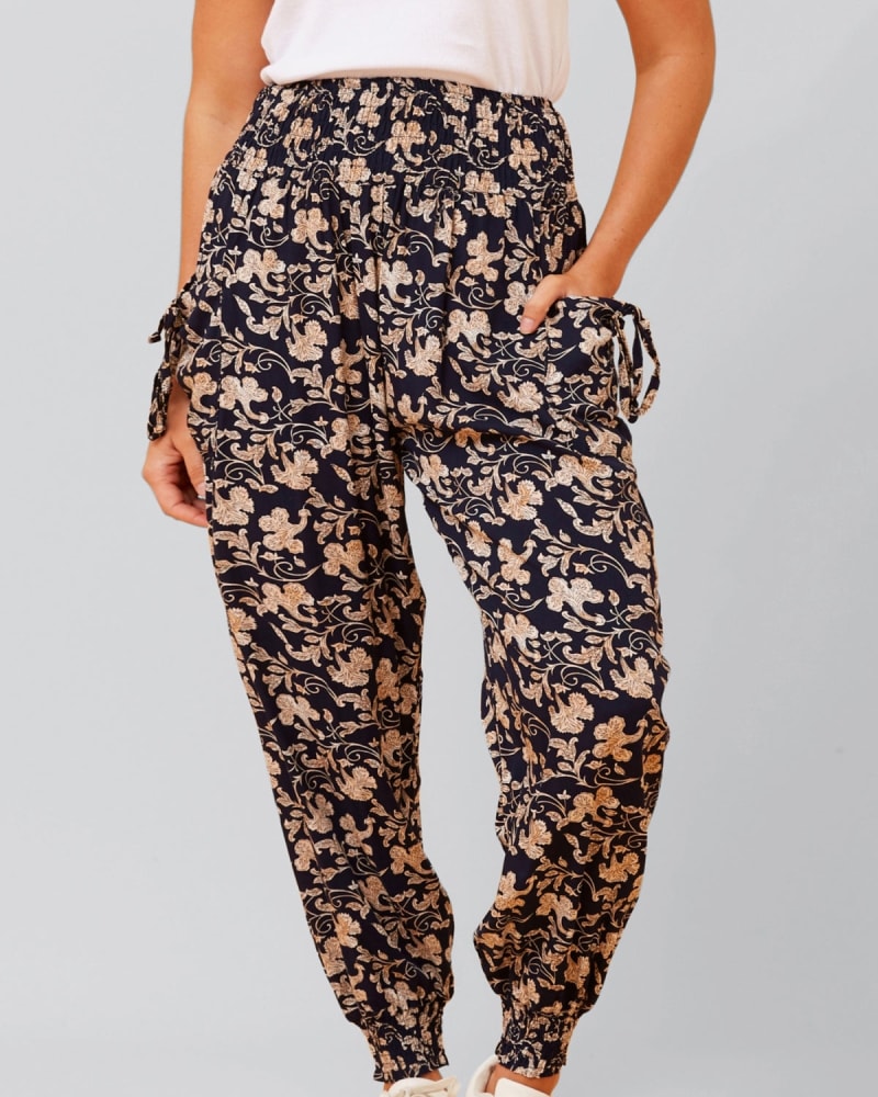 Front of a model wearing a size XL Edna Pants Harem Boho Smocked Waist in Navy by ANNICK. | dia_product_style_image_id:352578